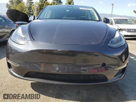 2024 Tesla Model Y with VIN 7SAYGDED7RF056973, listed as a Copart auction lot 55310705 with 15,391 mi miles and Salvage Title. Bid and sale history available at DreamBid. Image 5.