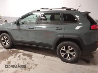 2015 Jeep Cherokee Trailhawk with VIN 1C4PJMBS6FW724931, listed as a IAAI auction lot 41602181 with 153,340 mi miles and . Bid and sale history available at carsss.com. Image 15.