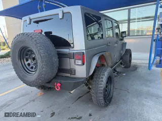 2015 Jeep Wrangler Unlimited Rubicon with VIN 1C4BJWFG3FL547025, listed as a Copart auction lot 53170835 with 103,707 mi miles and Clean Title. Bid and sale history available at carsss.com. Image 4.