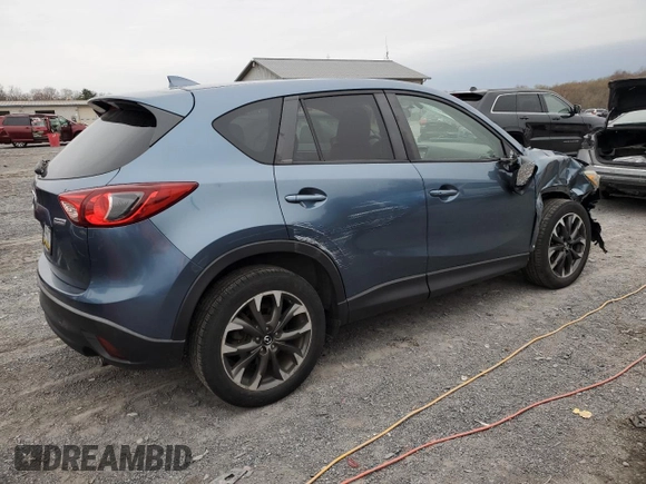 2016 Mazda CX-5 Grand Touring with VIN JM3KE4DY7G0761594, listed as a Copart auction lot 51514595 with 58,250 mi miles and Salvage Title. Bid and sale history available at DreamBid. Image 3.