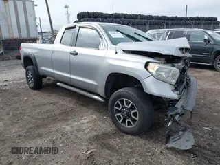 2014 Toyota Tundra SR with VIN 5TFCY5F17EX016925, listed as a IAAI auction lot 41649570 with 164,294 mi miles and . Bid and sale history available at DreamBid. Image 1.