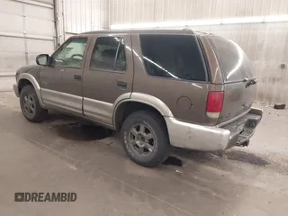 2001 Oldsmobile Bravada z VIN 1GHDT13W812133670, wystawiony jako IAAI lot #42224085 z przebiegiem 159 995 mil mil oraz . Historia ofert i sprzedaży dostępna na DreamBid. Obrazek 3.