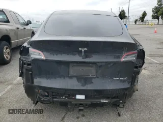 2021 Tesla Model Y Long Range z VIN 5YJYGAEE5MF143672, wystawiony jako Copart lot #55962875 z przebiegiem 74 644 mil mil oraz Szkoda całkowita • Salvage title. Historia ofert i sprzedaży dostępna na DreamBid. Obrazek 6.