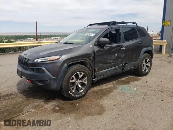 2014 Jeep Cherokee Trailhawk with VIN 1C4PJMBS6EW140981, listed as a Copart auction lot 58260325 with 97,036 mi miles and Salvage title. Bid and sale history available at DreamBid. Image 1.