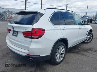 2016 BMW X5 sDrive35i with VIN 5UXKR2C55G0H43136, listed as a IAAI auction lot 41835931 with 125,751 mi miles. Bid and sale history available at carsss.com. Image 4.