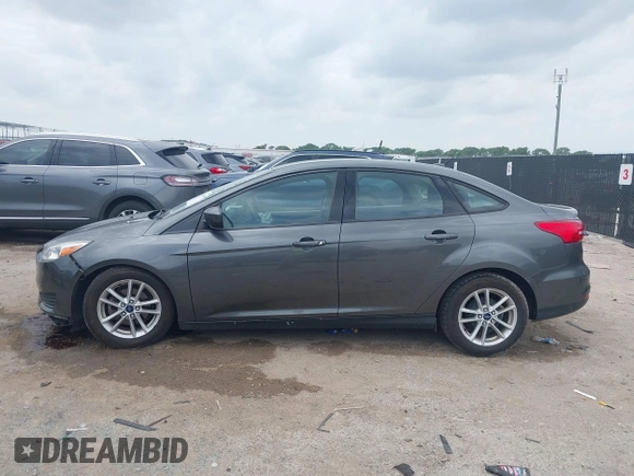 2018 Ford Focus SE z VIN 1FADP3F23JL321768, wystawiony jako IAAI lot #42415788 z przebiegiem 124 126 mil mil oraz . Historia ofert i sprzedaży dostępna na DreamBid. Obrazek 14.