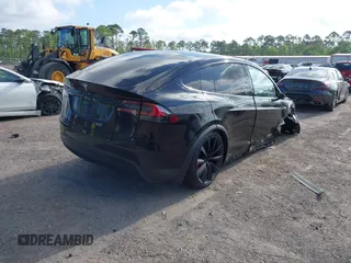 2016 Tesla Model X 70D z VIN 5YJXCAE29GF003478, wystawiony jako IAAI lot #41965737 z przebiegiem 105 930 mil mil oraz . Historia ofert i sprzedaży dostępna na DreamBid. Obrazek 4.