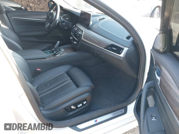 2023 BMW 5 Series M550i xDrive with VIN WBA13BK04PCL88909, listed as a IAAI auction lot 42045994 with 27,729 mi miles and . Bid and sale history available at DreamBid. Image 5.