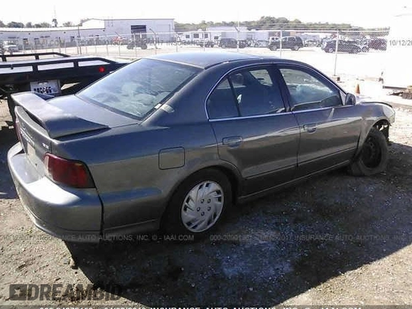 2003 Mitsubishi Galant ES z VIN 4A3AA46G53E217951, wystawiony jako IAAI lot #24872153 z przebiegiem 155 114 mil mil oraz . Historia ofert i sprzedaży dostępna na DreamBid. Obrazek 4.