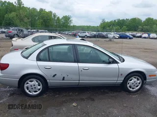 2002 Saturn SL z VIN 1G8ZK52762Z131497, wystawiony jako IAAI lot #42086108 z przebiegiem 119 273 mil mil oraz . Historia ofert i sprzedaży dostępna na DreamBid. Obrazek 13.