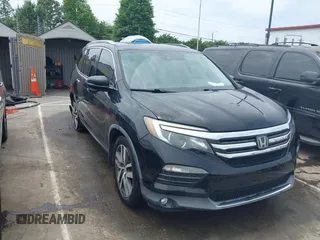 2016 Honda Pilot Touring with VIN 5FNYF5H95GB013971, listed as a IAAI auction lot 42312260 with 143,679 mi miles and . Bid and sale history available at DreamBid. Image 1.