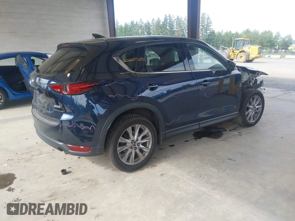 2019 Mazda CX-5 Grand Touring with VIN JM3KFBDM6K0522903, listed as a IAAI auction lot 42583005 with 61,174 mi miles and . Bid and sale history available at DreamBid. Image 4.