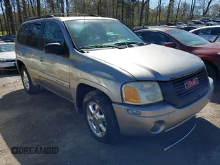 2002 GMC Envoy SLT with VIN 1GKDS13S622158143, listed as a IAAI auction lot 41886178 with 217,310 mi miles. Bid and sale history available at carsss.com. Image 1.