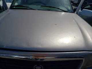 2000 Cadillac Escalade z VIN 1GYEK63R5YR187895, wystawiony jako Copart lot #72468044 z przebiegiem 189 026 mil mil oraz Tytuł czysty. Historia ofert i sprzedaży dostępna na DreamBid. Obrazek 11.