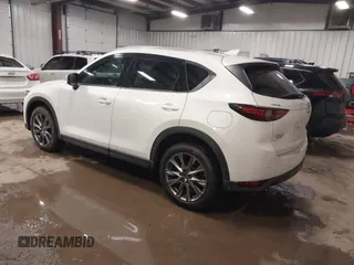 2019 Mazda CX-5 Signature with VIN JM3KFBEY5K0520593, listed as a IAAI auction lot 41638594 with 111,504 mi miles. Bid and sale history available at carsss.com. Image 3.