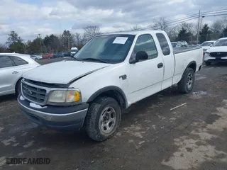 1999 Ford F-150 Work Series with VIN 1FTRX18W2XNB30523, listed as a IAAI auction lot 41617531 with 319,673 mi miles. Bid and sale history available at carsss.com. Image 17.