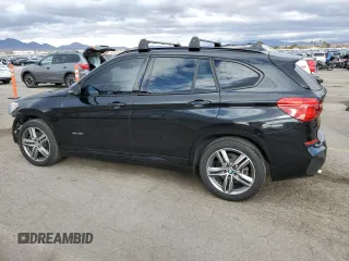 2016 BMW X1 xDrive28i with VIN WBXHT3C36G5E53172, listed as a Copart auction lot 48594805 with 69,038 mi miles and Salvage Title. Bid and sale history available at carsss.com. Image 2.