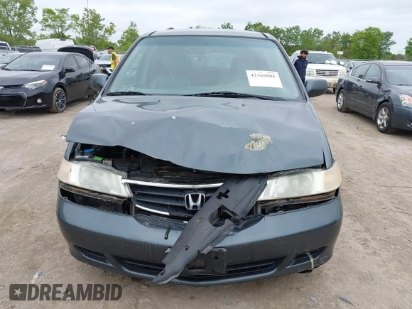2003 Honda Odyssey EX-L z VIN 5FNRL18053B133092, wystawiony jako IAAI lot #42365081 z przebiegiem 239 753 mil mil oraz . Historia ofert i sprzedaży dostępna na DreamBid. Obrazek 12.