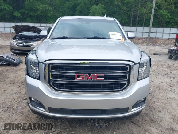 2019 GMC Yukon XL SLT z VIN 1GKS1GKC0KR242408, wystawiony jako IAAI lot #42144783 z przebiegiem Nie podano mil oraz . Historia ofert i sprzedaży dostępna na DreamBid. Obrazek 11.