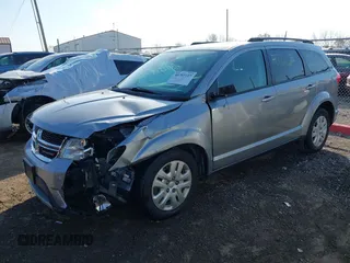 2019 Dodge Journey SE with VIN 3C4PDCBB6KT835643, listed as a IAAI auction lot 40702227 with 99,691 mi miles and . Bid and sale history available at DreamBid. Image 2.