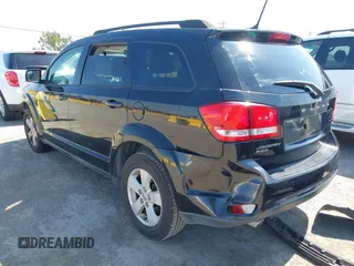 2012 Dodge Journey SXT with VIN 3C4PDDBG0CT300469, listed as a IAAI auction lot 42467233 with 127,420 mi miles and . Bid and sale history available at DreamBid. Image 3.