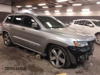 2015 Jeep Grand Cherokee Overland with VIN 1C4RJFCG1FC215426, listed as a IAAI auction lot 41689821 with 128,563 mi miles. Bid and sale history available at carsss.com. Image 1.