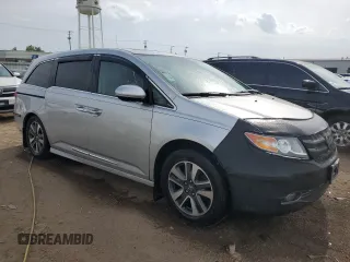 2014 Honda Odyssey Touring with VIN 5FNRL5H93EB034263, listed as a Copart auction lot 57254485 with 150,084 mi miles and Salvage title. Bid and sale history available at DreamBid. Image 4.
