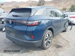 2023 Volkswagen ID.4 Pro z VIN 1V2DNPE8XPC019169, wystawiony jako IAAI lot #41313501 z przebiegiem 32 552 mil mil oraz . Historia ofert i sprzedaży dostępna na DreamBid. Obrazek 4.