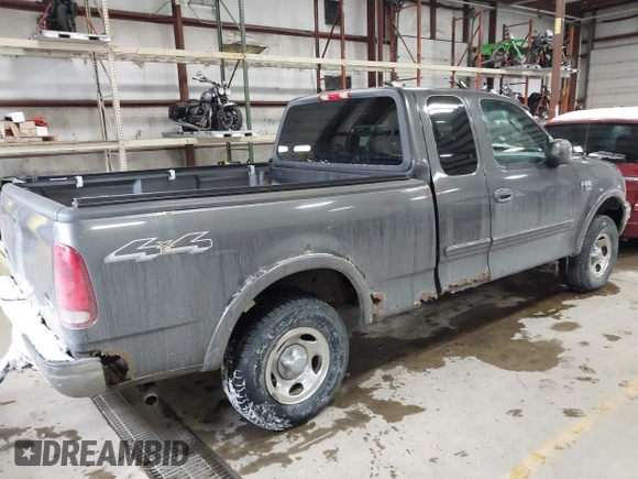 2003 Ford F-150 XL with VIN 1FTRX18W63NB69173, listed as a IAAI auction lot 41618645 with 219,506 mi miles. Bid and sale history available at carsss.com. Image 4.