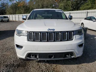 2019 Jeep Grand Cherokee Overland with VIN 1C4RJFCT2KC834690, listed as a Copart auction lot 84303144 with 63,053 mi miles and Salvage Title. Bid and sale history available at carsss.com. Image 5.