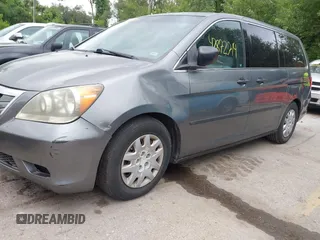 2009 Honda Odyssey LX with VIN 5FNRL38269B043326, listed as a IAAI auction lot 42872714 with 235,087 mi miles and . Bid and sale history available at DreamBid. Image 6.
