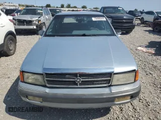 1989 Dodge Spirit z VIN 1B3BA46K1KF408949, wystawiony jako Copart lot #80767594 z przebiegiem 137 766 mil mil oraz Nie do naprawy. Historia ofert i sprzedaży dostępna na DreamBid. Obrazek 5.