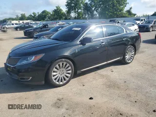 2013 Lincoln MKS with VIN 1LNHL9DK8DG610053, listed as a Copart auction lot 61727245 with 95,816 mi miles and Clean title. Bid and sale history available at DreamBid. Image 1.