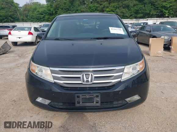 2011 Honda Odyssey Touring with VIN 5FNRL5H90BB070472, listed as a IAAI auction lot 42367710 with 203,589 mi miles and . Bid and sale history available at DreamBid. Image 6.