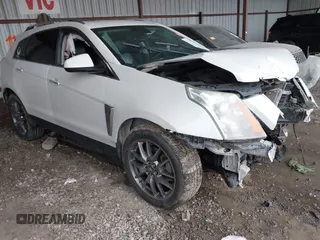 2015 Cadillac SRX Performance Collection z VIN 3GYFNCE30FS612940, wystawiony jako IAAI lot #41936572 z przebiegiem 224 769 mil mil oraz . Historia ofert i sprzedaży dostępna na DreamBid. Obrazek 1.