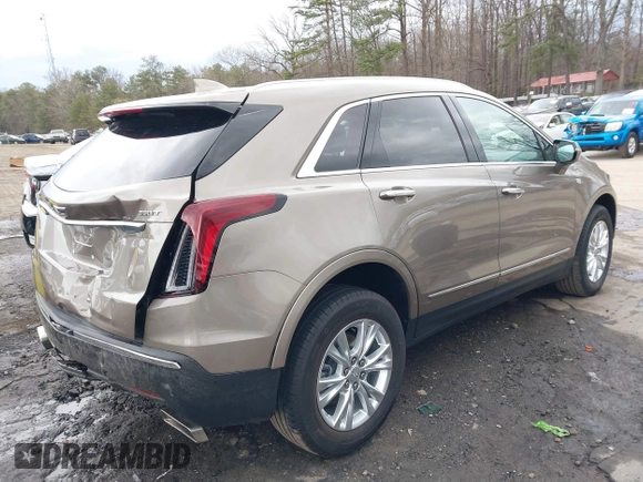 2023 Cadillac XT5 FWD Luxury z VIN 1GYKNAR45PZ140440, wystawiony jako IAAI lot #41723317 z przebiegiem 25 124 mil mil oraz . Historia ofert i sprzedaży dostępna na DreamBid. Obrazek 4.
