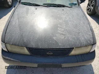1997 Nissan Sentra XE z VIN 3N1AB41D3VL035555, wystawiony jako Copart lot #76200984 z przebiegiem 166 012 mil mil oraz Szkoda całkowita • Salvage title. Historia ofert i sprzedaży dostępna na DreamBid. Obrazek 11.