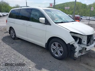 2010 Honda Odyssey Touring с VIN 5FNRL3H90AB039449, выставлен на аукционе IAAI как лот 42032203 с пробегом 128 265 миль миль и . История ставок и продаж доступна на DreamBid. Изображение 1.