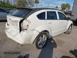 2009 Dodge Caliber SXT with VIN 1B3HB48A69D130857, listed as a IAAI auction lot 41526199 with 163,796 mi miles and . Bid and sale history available at DreamBid. Image 4.