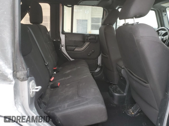 2015 Jeep Wrangler Unlimited Willys Wheeler with VIN 1C4BJWDG9FL516493, listed as a Copart auction lot 45098345 with 152,009 mi miles and Salvage Title. Bid and sale history available at DreamBid. Image 11.