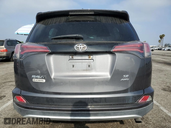 2016 Toyota RAV4 SE with VIN 2T3JFREV9GW453907, listed as a Copart auction lot 60438385 with 59,288 mi miles and Salvage title. Bid and sale history available at DreamBid. Image 6.