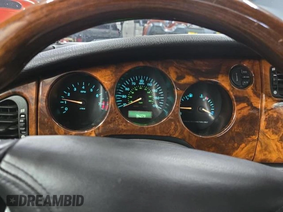 1997 Jaguar XK with VIN SAJGX5748VC006720, listed as a Copart auction lot 80928284 with 96,279 mi miles and Clean Title. Bid and sale history available at DreamBid. Image 8.