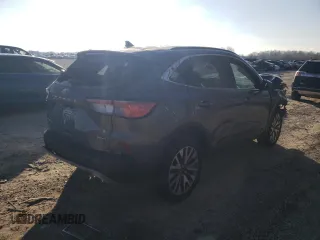 2021 Ford Escape Titanium with VIN 1FMCU9J90MUB16909, listed as a Copart auction lot 42547724 with 24,300 mi miles and Salvage Title. Bid and sale history available at carsss.com. Image 3.