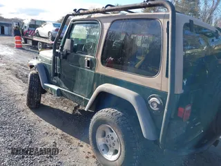 2000 Jeep Wrangler Sahara with VIN 1J4FA59S0YP724521, listed as a IAAI auction lot 41574689 with 167,584 mi miles. Bid and sale history available at carsss.com. Image 3.