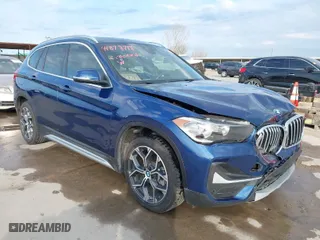 2021 BMW X1 xDrive28i with VIN WBXJG9C07M5T98125, listed as a IAAI auction lot 41878718 with 34,331 mi miles. Bid and sale history available at carsss.com. Image 1.