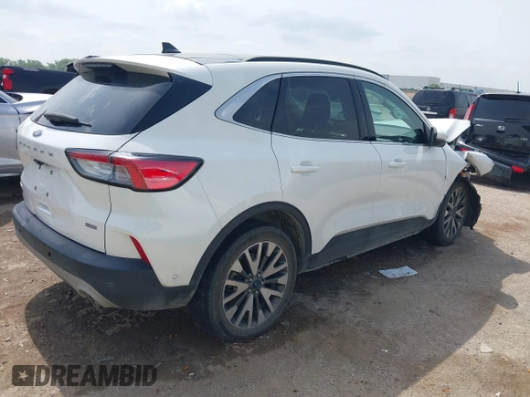 2020 Ford Escape Titanium Hybrid with VIN 1FMCU0DZ9LUA54867, listed as a IAAI auction lot 42268245 with 68,974 mi miles and . Bid and sale history available at DreamBid. Image 4.