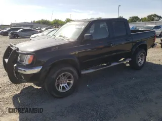 2000 Nissan Frontier XE z VIN 1N6ED27Y3YC324102, wystawiony jako Copart lot #56922155 z przebiegiem 202 233 mil mil oraz Szkoda całkowita • Salvage title. Historia ofert i sprzedaży dostępna na DreamBid. Obrazek 1.