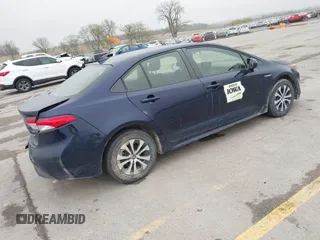 2021 Toyota Corolla Hybrid LE with VIN JTDEAMDE9MJ003172, listed as a IAAI auction lot 42062851 with 96,753 mi miles. Bid and sale history available at carsss.com. Image 4.