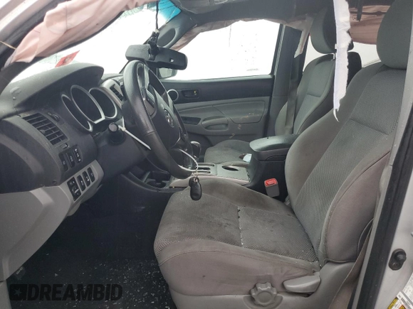 2013 Toyota Tacoma with VIN 5TFLU4EN8DX065656, listed as a Copart auction lot 63486165 with 185,018 mi miles and Salvage title. Bid and sale history available at DreamBid. Image 7.