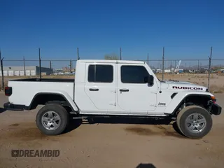 2020 Jeep Gladiator Rubicon with VIN 1C6JJTBG6LL187235, listed as a IAAI auction lot 42010374 with Not Provided miles and . Bid and sale history available at DreamBid. Image 13.